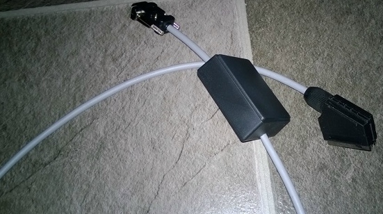 Photo of RGBI to SCART case and cables.